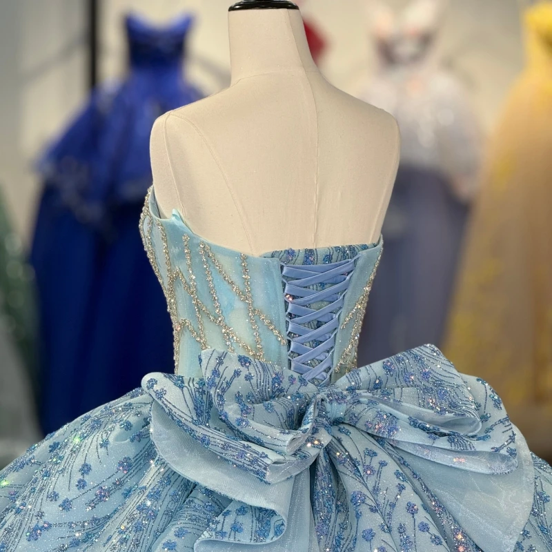 فساتين Quinceanera لامعة باللون الأزرق السماوي ثوب حفلة قبالة الكتف مزين بالدانتيل مطرز بفيونكة مشد متدرج تول حفلة عيد ميلاد حلوة