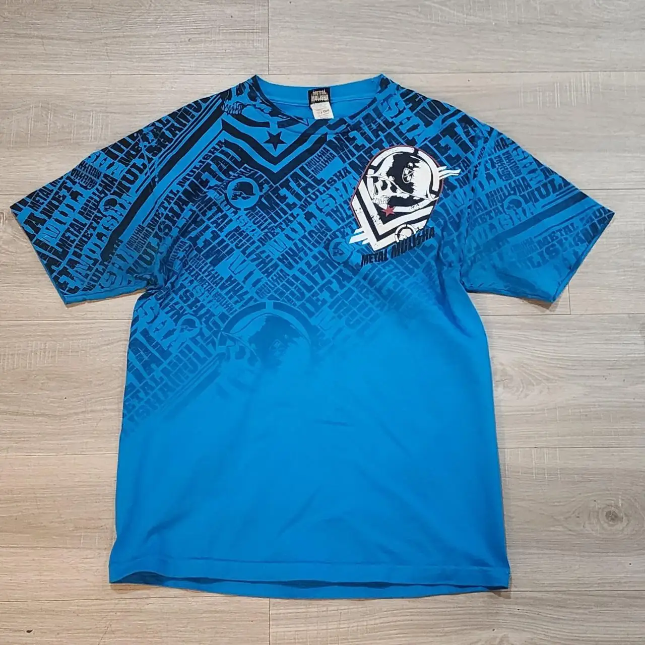 

Blue Gradient Metal Mulisha T - Shirt | Skull Graphic & All - Over Print Streetwear