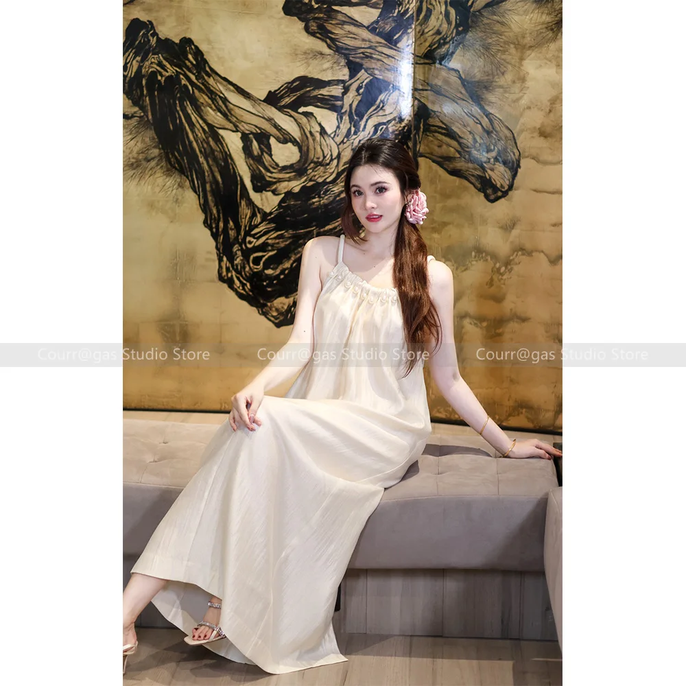 

Niche design sense of elegance temperament pearl hanging neck loose dress female summer gentle belt waist thin long skirt