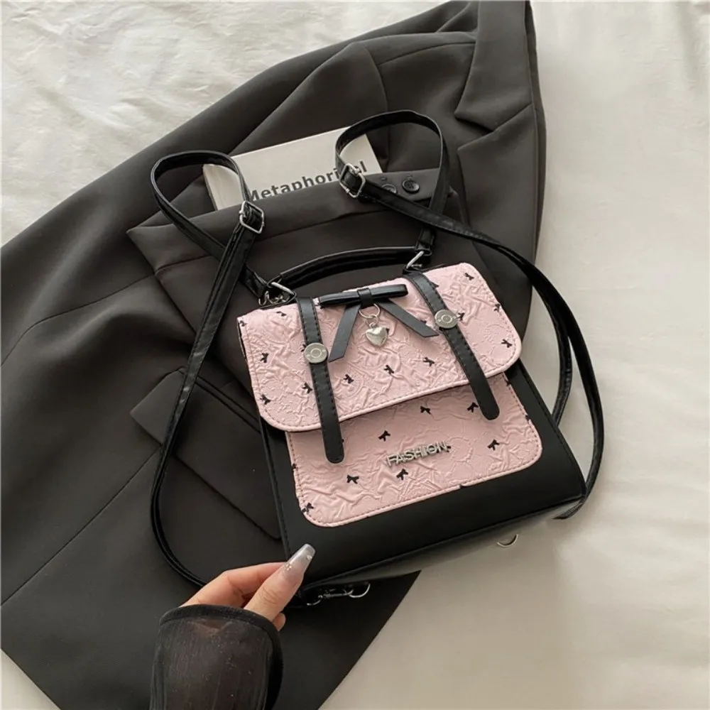 حقيبة ظهر نسائية على الطراز الياباني الجديد مصنوعة من جلد البولي يوريثان باللون الوردي والأبيض وحزام قابل للتحويل حقيبة كتف متينة مقاومة للماء للاستخدام غير الرسمي
