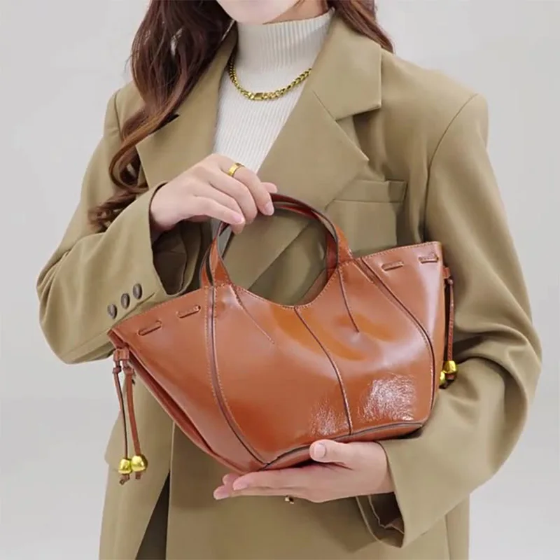 

﻿Fashionable Autumn New Women's Beaded Shoulder Strap Handbag Luxury Designer Double Handle PU Material Large Capacity Crossbod