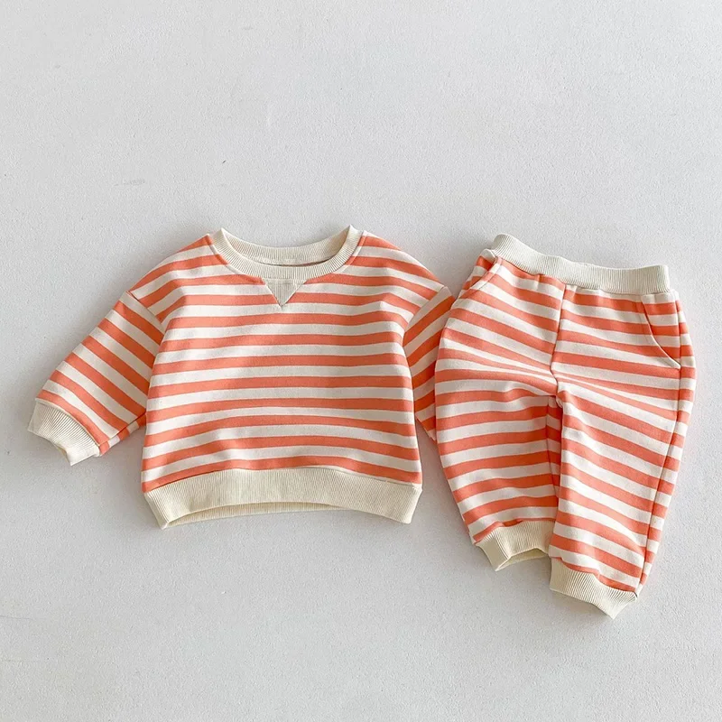 2025 nuevo conjunto de ropa de primavera para bebés y niños, jersey de manga larga de algodón a rayas, Tops + Pantalones, ropa deportiva para niños, traje