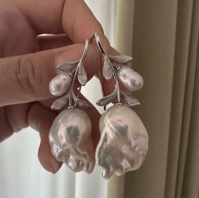 

elegant pair of south sea baroque white pearl stud earring 925s