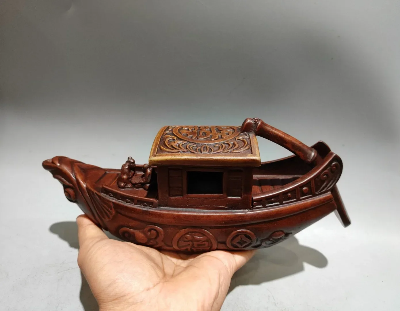 A traditional Chinese wedding boat-shaped teapot, with an inscription on the base reading 'Made during the Qianlo,