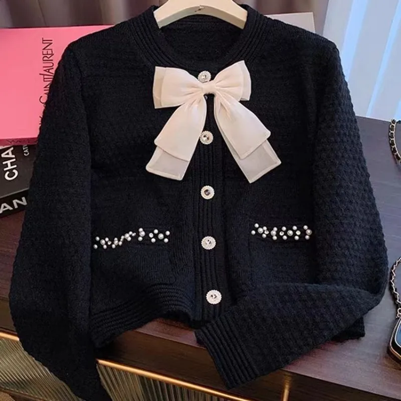 Cardigan sweater jacket women\'s autumn and winter new Korean version red bow nail bead knitted top