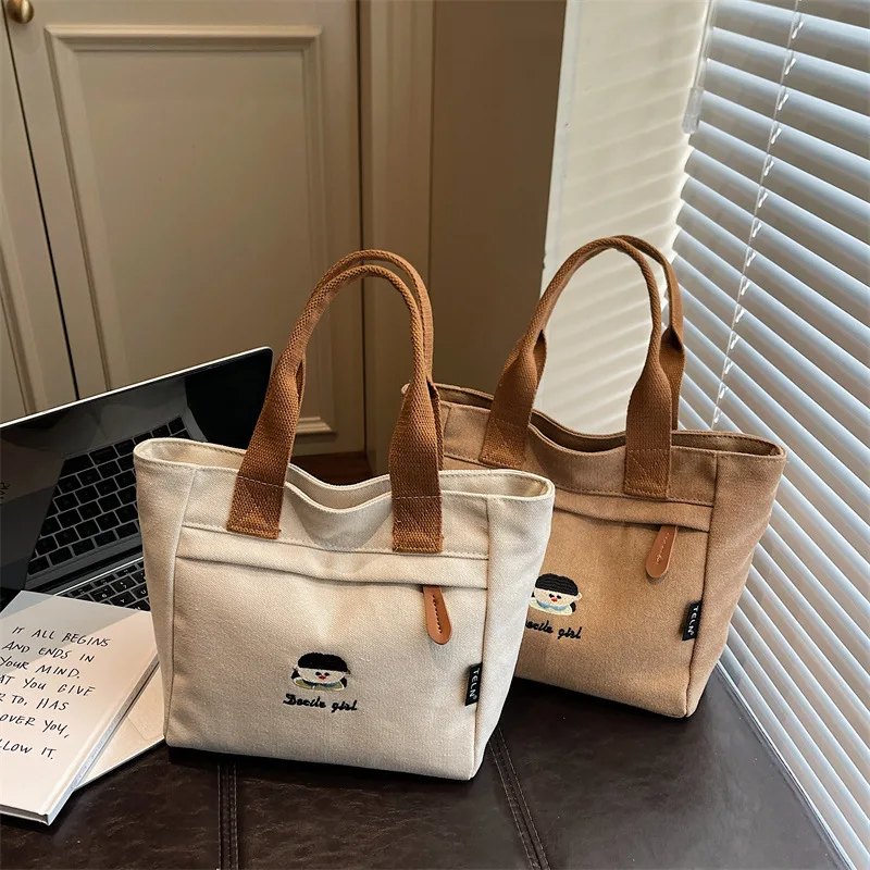 

New Cartoon Embroidery Canvas Top-Handle Bags Fashion Casual Tote Bag Fashionable and Versatile for Daily Use Commuting Bag