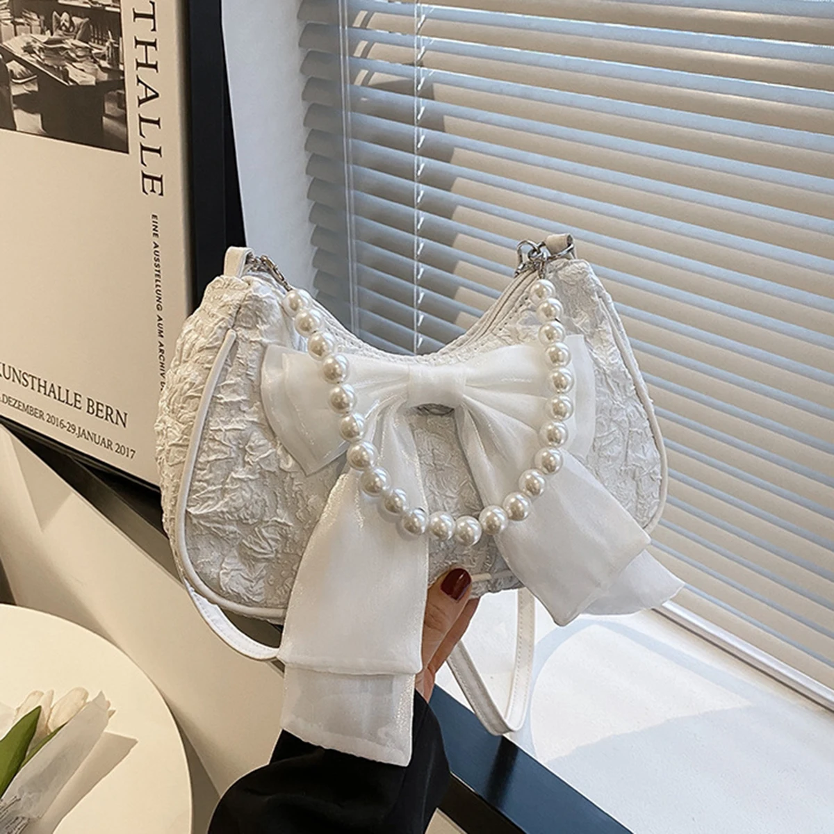 White folds pop retro bow bag Female Pearl handle New fashion pearl armpit shoulder crossbody bag 1 outfit view 5