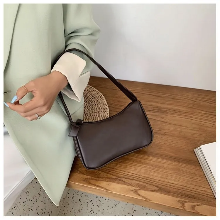 Retro forearm bag women's bow handbag PU leather baguette bag Western style shoulder bag Underarm moisture