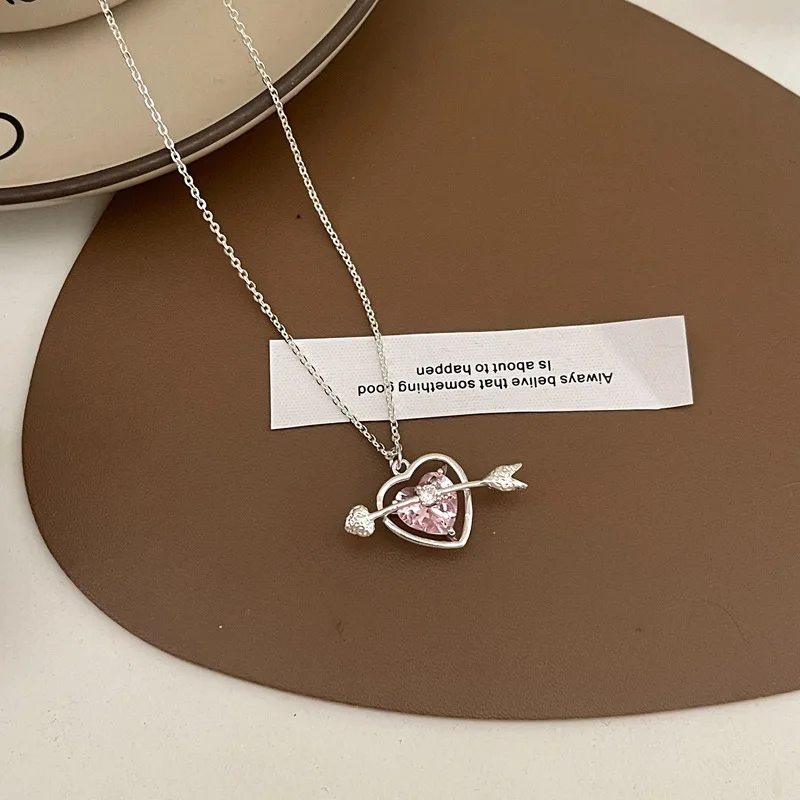 Silver Cupid Arrow Through Heart Pendant Necklace Pink Cubic Zirconia Hollow Love Charm Dainty Cable Chain Romantic Valentine’s Day Neck Jewelry Gift for Women Girlfriend