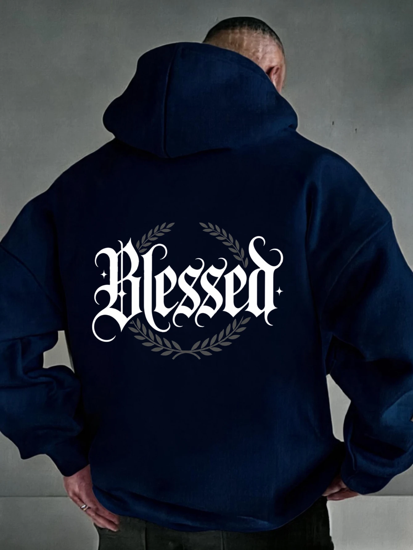 Oversized colorful hoodie, streetwear style, featuring white Gothic lettering and a laurel wreath print; unisex casual wear.