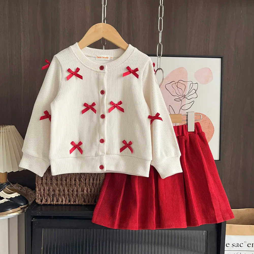 2026 Korean Version Children's Clothing Spring and Autumn New Toddler Girl Clothes Bow Long Sleeved Cardigan + Red Short Skirt