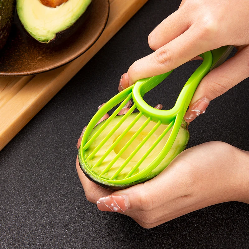 A Multifunctional Avocado Slicer Three-in-One Household Multifunctional Tool, Suitable for Outdoor Use, Home and Camping Scenari