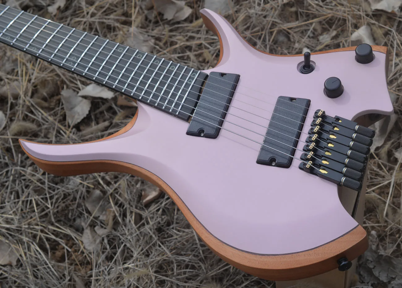 2024 Fanned frets 7 Strings Headless Electric Guitar Pink color 5-ply Roasted Maple Neck Ergonomic Ebony MAHOGANY