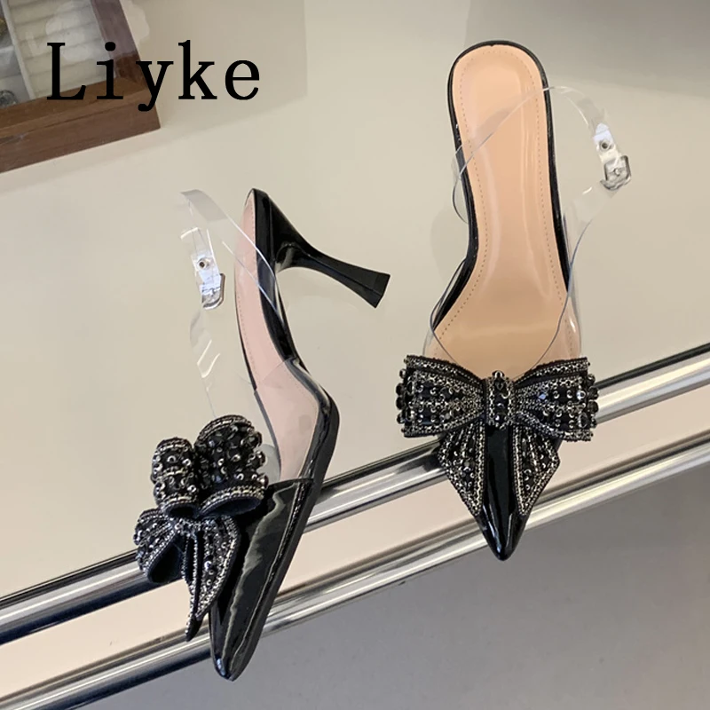 

Летние модные женские туфли Liyke с кристаллами и бантом, элегантные туфли-лодочки на шпильке с острым носком, свадебные и выпускные туфли, сексуальные босоножки с ремешком на пряжке