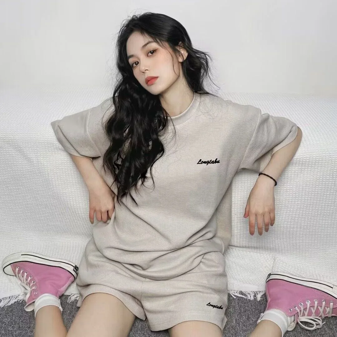 Koreaanse stijl casual sportpak dames zomer nieuwe losse en afslankende T-shirt met korte mouwen shorts modieuze tweedelige set