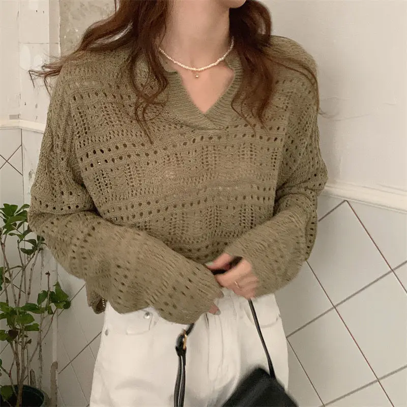 Polo Pullover da donna autunno e inverno con top elegante con fondo lavorato a maglia a maniche lunghe in tinta unita traforato