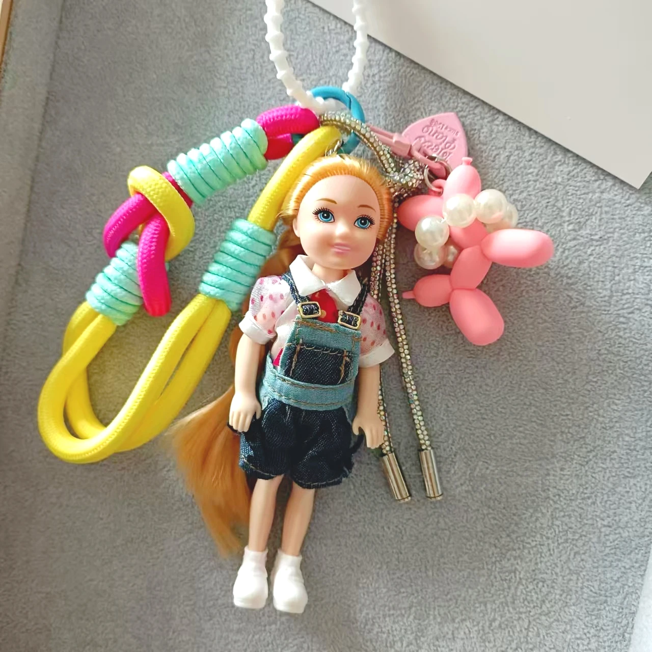 Sweet-Cute Multi-Style Fashion Doll Keychain with Diverse Outfits Heart/Bowknot Pendant Colorful Woven Lanyard Bag Accessory for
