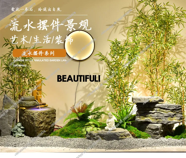 circulating water landscape, rockery stone landscaping under the stairs, simulated bamboo potted plants, image wall layout