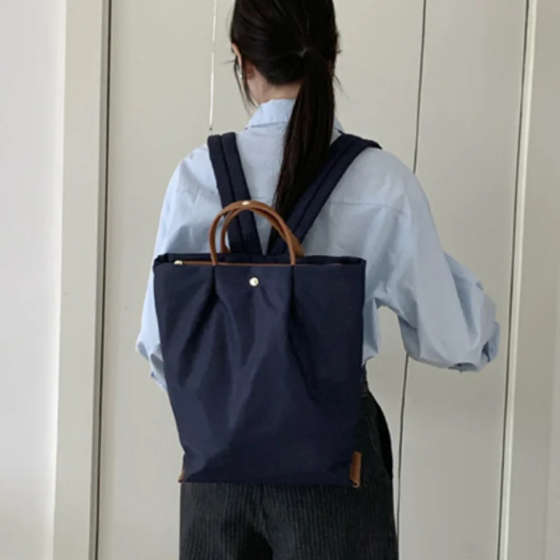 

Ultralight Trend Large Capacity Backpack Japanese Minimalist Handbag Casual Waterproof Nylon Travel Tote With Top Handle Design