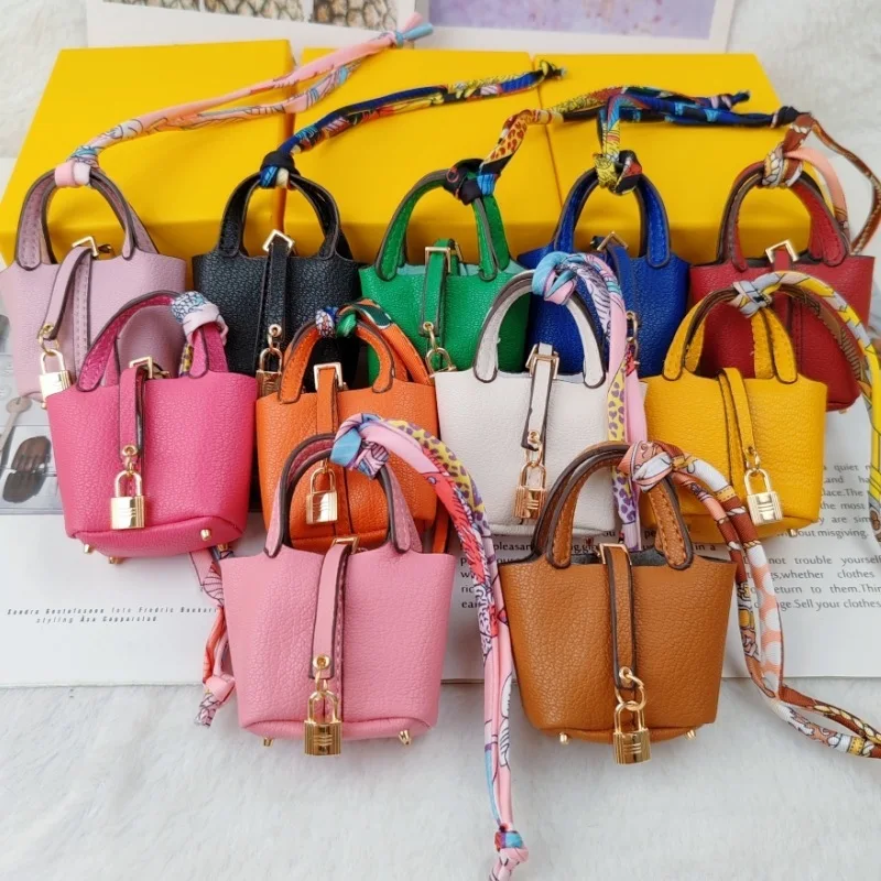 Mini bolso colgante llavero de coche accesorio colgante billetera cero pulsera portátil creativa bolsa para auriculares Bluetooth multifuncional