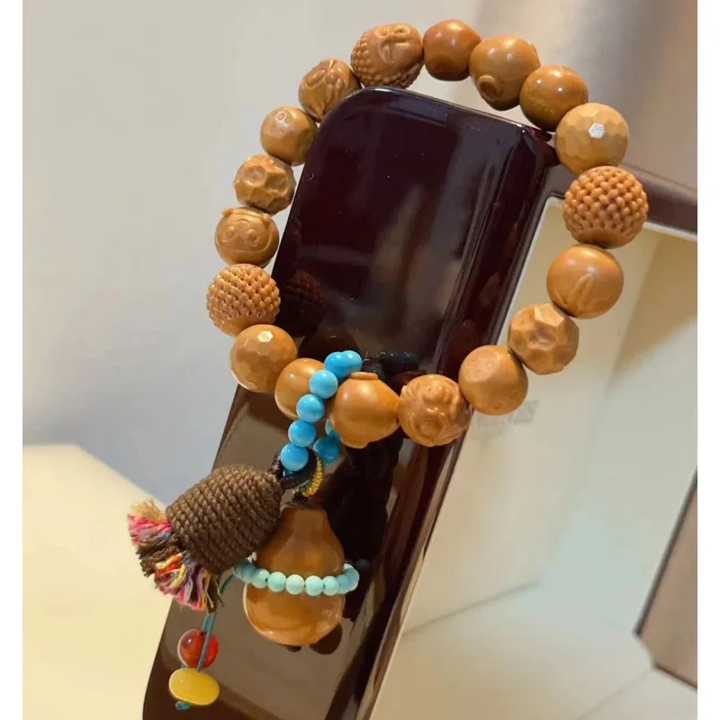 

Design Monkey Multi-Treasure With Olive Stone Gourd Small Tassel Buddhist Bead Bracelet