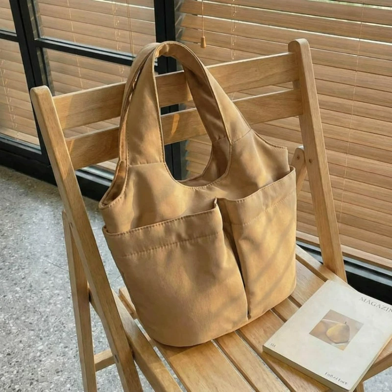 

Модная женская текстура, простая и универсальная большая сумка, повседневная простая сумка на плечо, новая однотонная нейлоновая повседневная сумка-ведро для путешествий