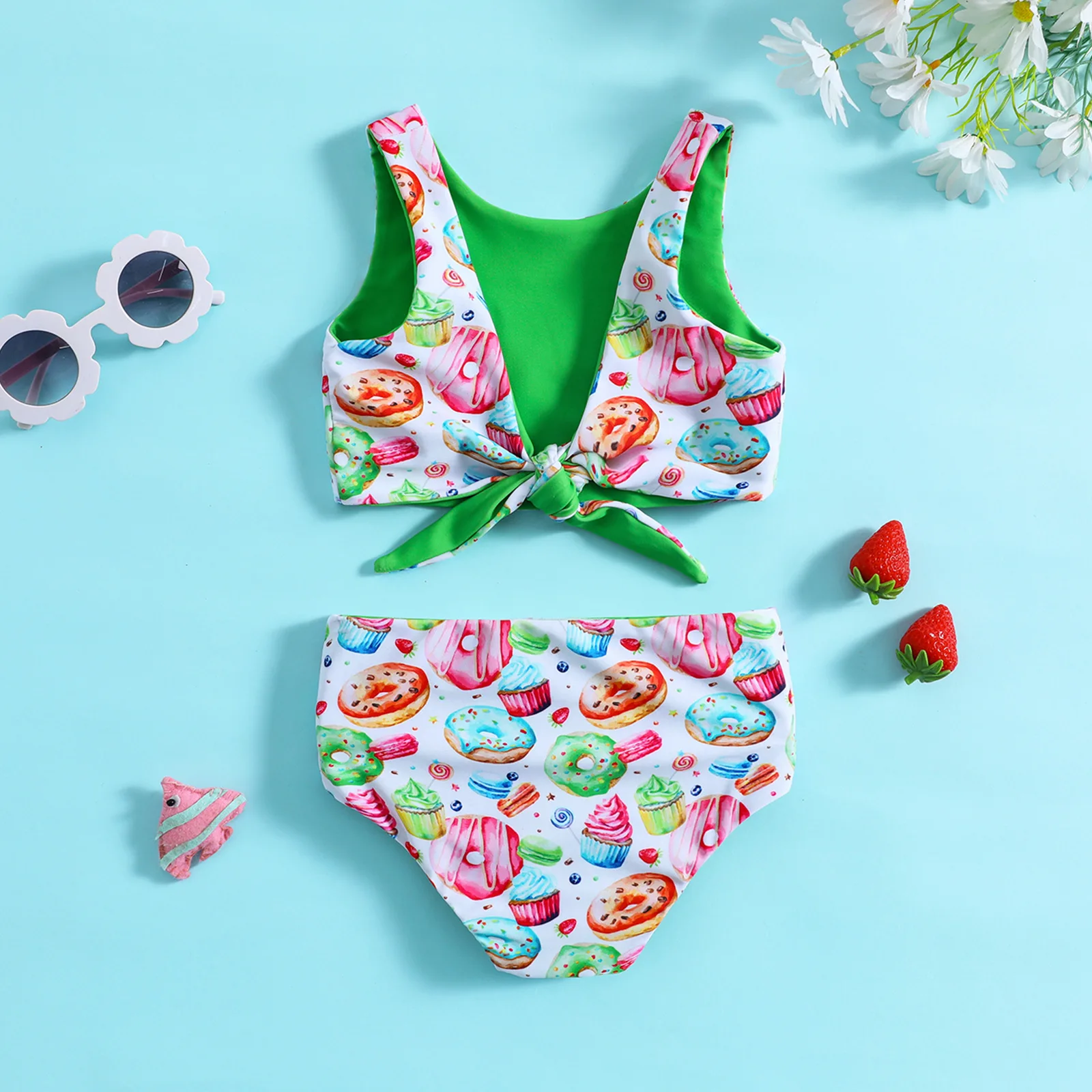 Baby two piece swimsuit printed with donut and cupcake pattern suitable for seaside trips and pool water play