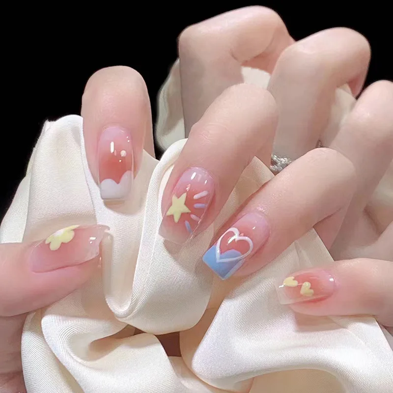 

24PCS Sweet Blush Press-On Nails – Medium-Long Square Shape With Star, Heart & Floral Motifs on Blue Base (Playful Candy Style)