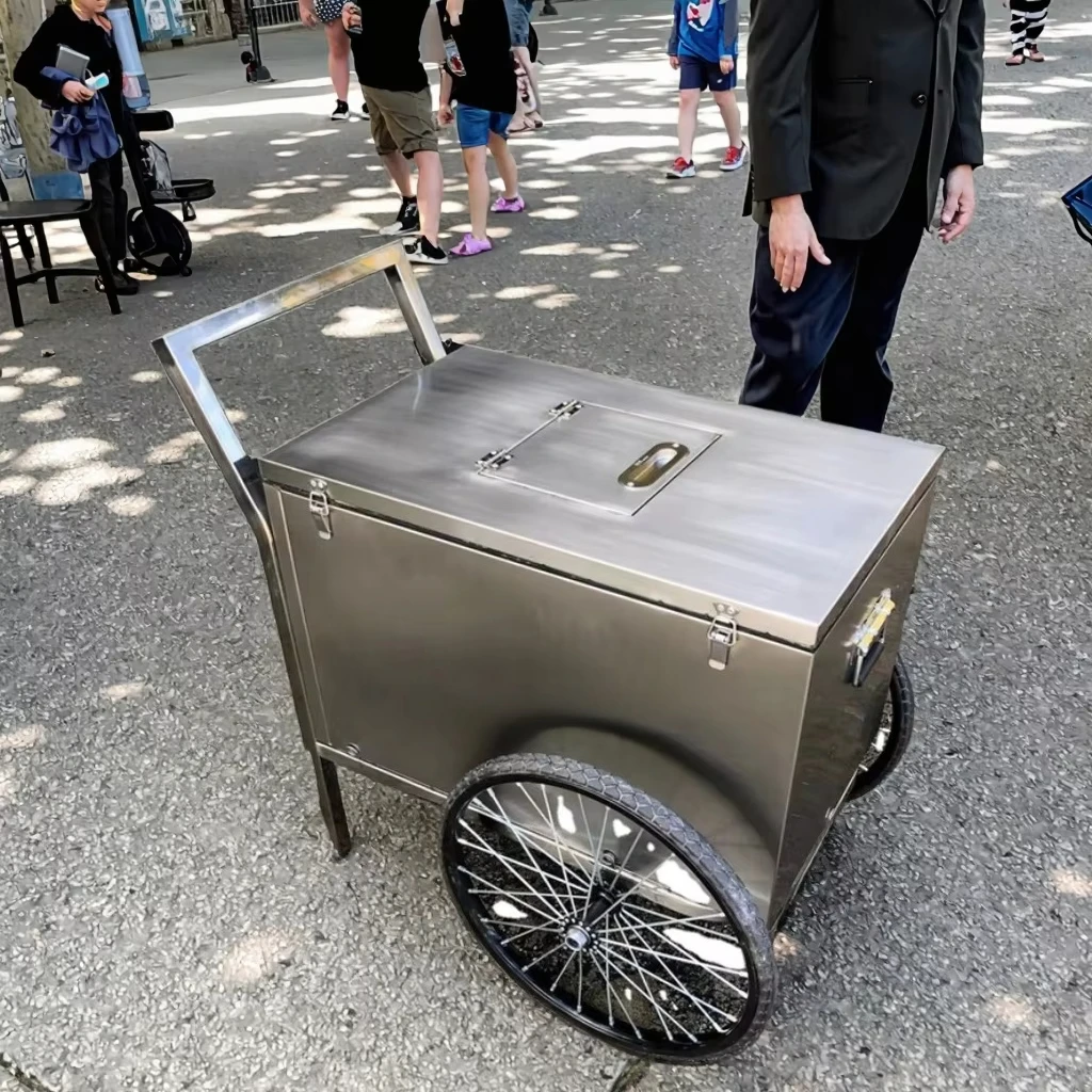

Household ice cooler trolley with cooling compartment