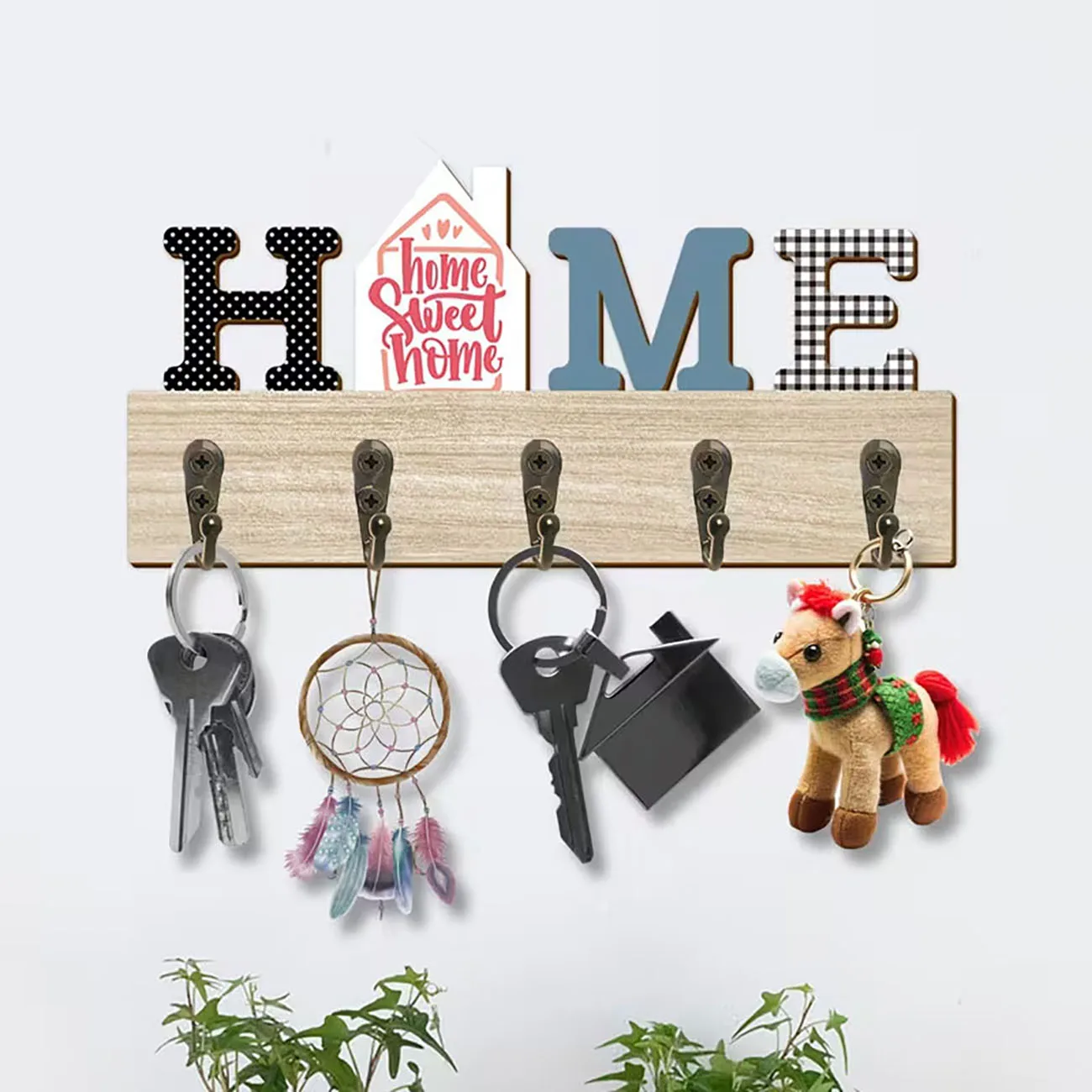 Wooden key rack with patterned HOME letters and house sign, five metal hooks, sweet home entryway wall decor.