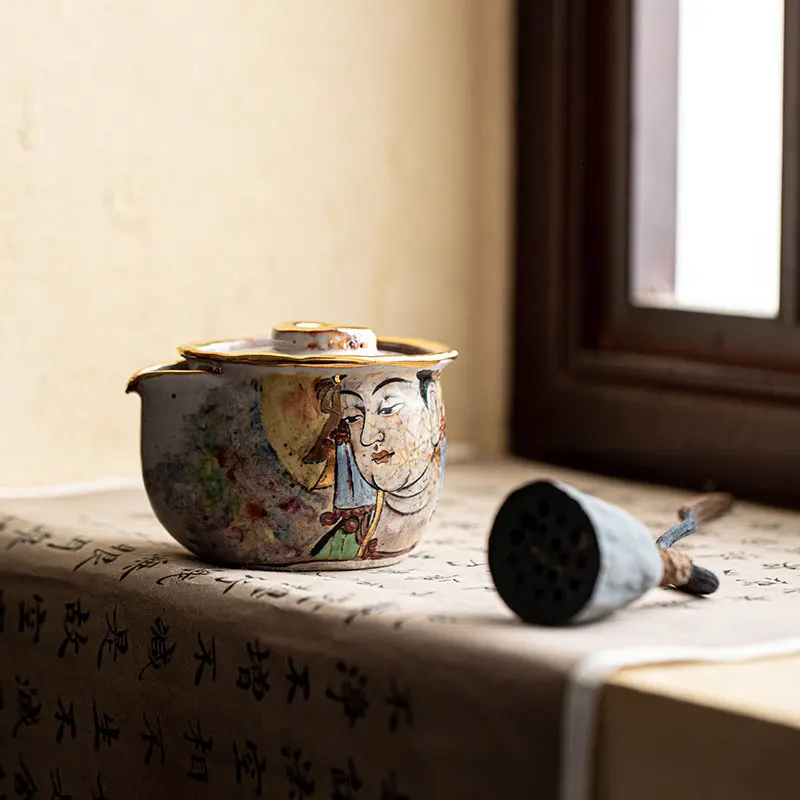 Hand-painted, teapot is retro. If you grab pot, cover bowl and open piece, you can raise teapot.