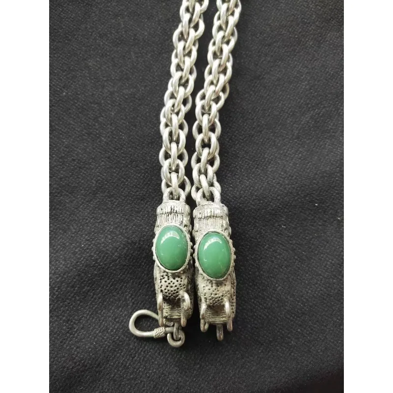 A classic handmade bracelet made of Tibetan silver dragon head necklace inlaid with jade and stones, a holiday gift for friends
