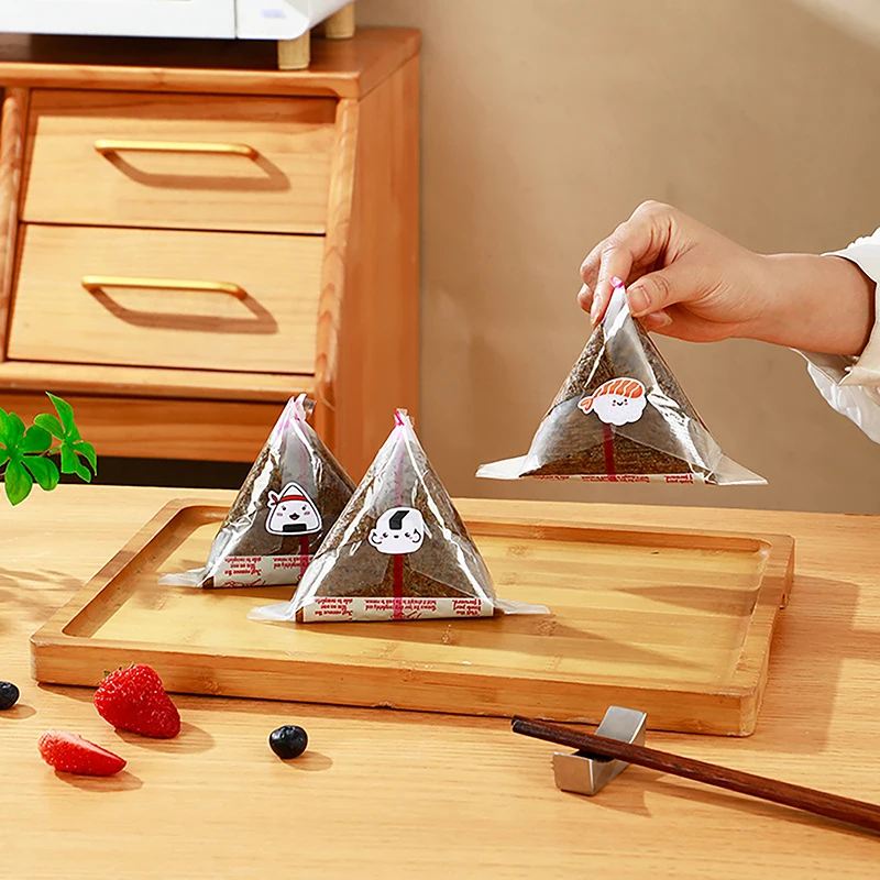 10/50/100 Uds. Envoltorios de Onigiri de algas marinas con bolas de arroz triangulares japonesas de doble capa bolsas de embalaje de plástico desechables para Sushi Bento