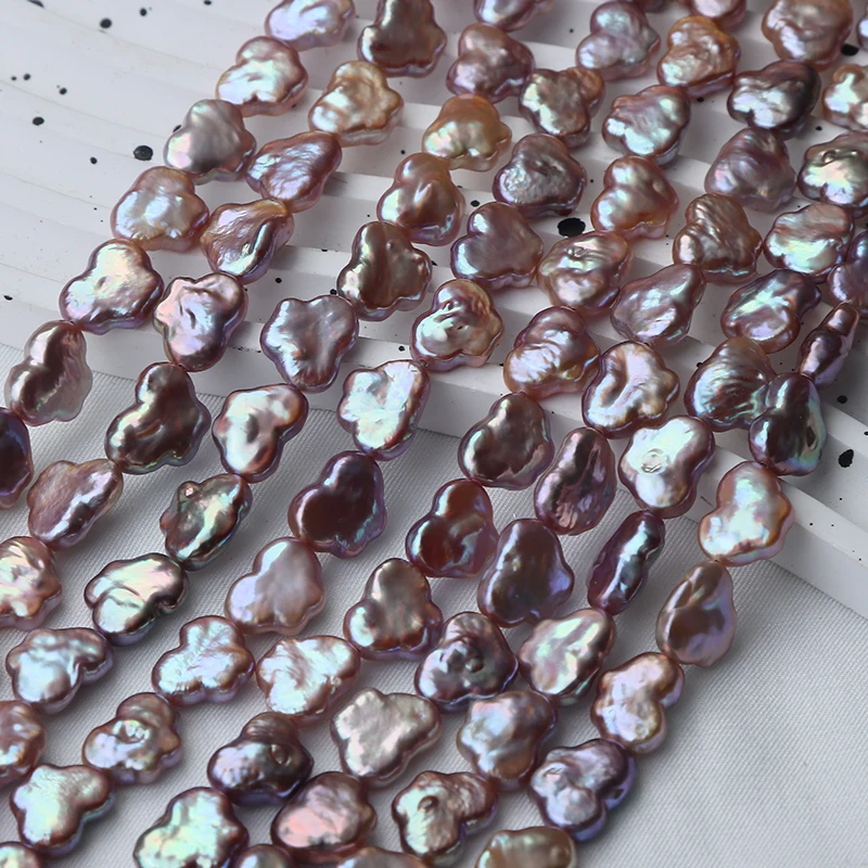 A strand of natural purple metallic luster butterfly-shaped side-hole irregular bare beads, approximately 32-34 pieces.