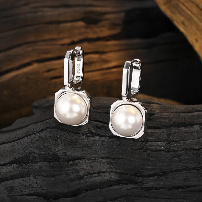 

Sterling silver heavy unique design pearl earrings