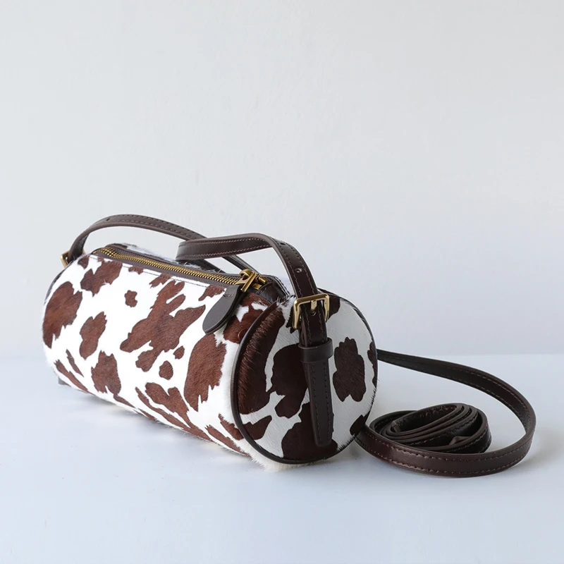 Bolsos cilíndricos vintage de pelo de caballo auténtico para mujer bolsos y carteras de diseño de lujo novedad 2026 con correa de piel de vaca y estampado de vaca bolso de hombro pequeño para axila alta calidad