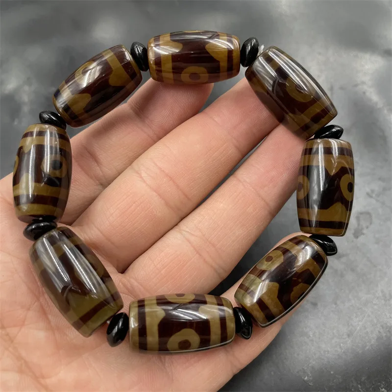 Vintage distressed bright brown three-eye dzi agate bracelet with tube beads