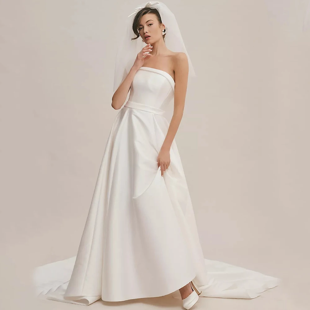 

Charming Strapless Sleeveless Wedding Dress with Belt A-Line Satin Floor Length Sweep Train Bow Bridal Romantic Backless Gowns