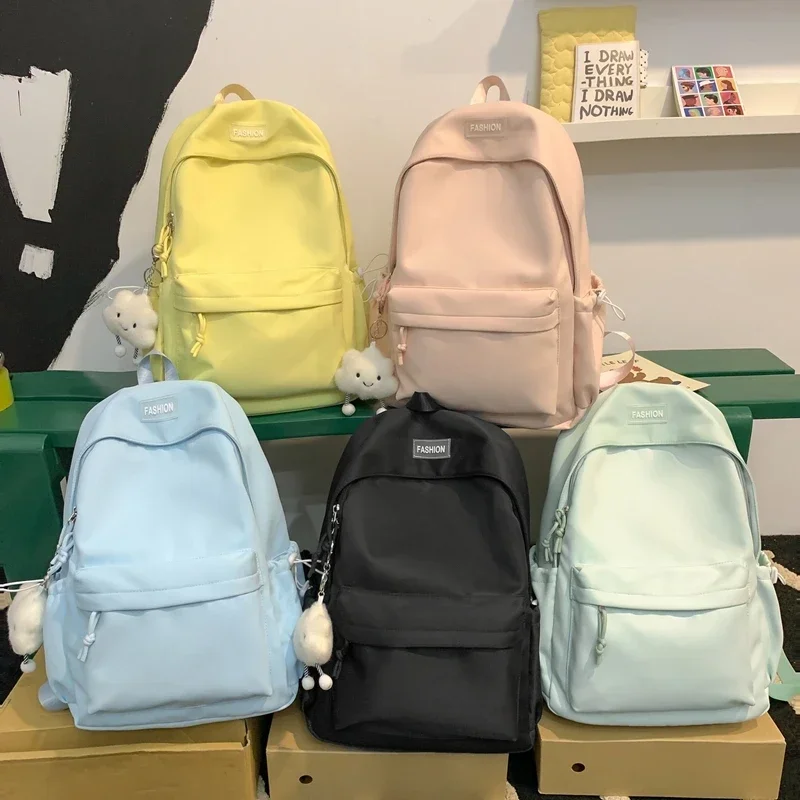 Mochilas de nailon con cremallera sólida y fresca, mochilas escolares versátiles informales simples de gran capacidad de alta calidad para mujer, nuevo estilo novedoso 2025