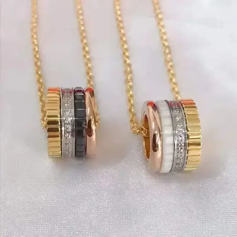 

CY 2025 New Hot High Quality Stainless Steel Black And White Ceramics Rotating Gears Necklace For Women And Men Fashion Jewelry