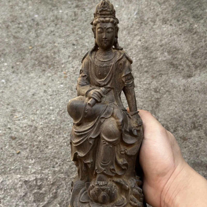 Agarwood carving seated lotus lotus statue of mercy in the South China Sea Goddess of Mercy Bodhisattva holding sutras