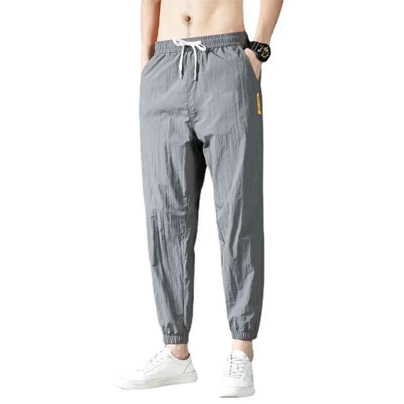 กางเกงลำลองผู้ชายทรงหลวม Spor Ice Silk Qui Dry Thin Summer Breezy กางเกงวัยรุ่นแฟชั่นเอวต่ำยืดไมโคร