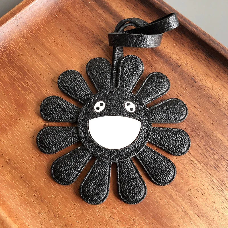 المألوف الحد الأدنى الحديثة جلد أسود عباد الشمس الوجه المبتسم حقيبة سلسلة مفاتيح قلادة التبعي