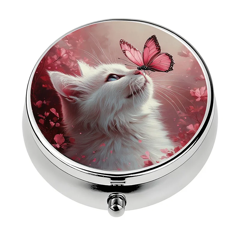 A small pill box with a three-compartment design, featuring a cat and butterfly pattern, is perfect for carrying in a purse or handbag. This pill organizer is perfect for travel and organizing vitamins.