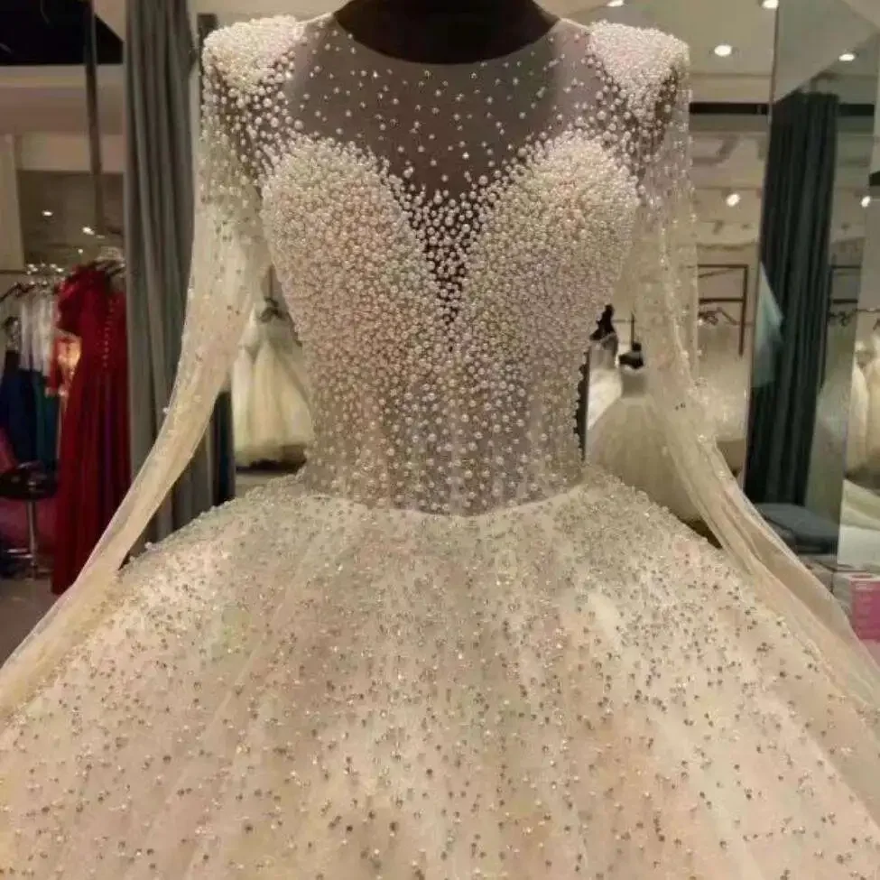 

Customized Amazing Scoop Neck Heavy Pearls Beads Wedding Dress Abiti Da Sposa See Through Long Sleeves Ballgown Puffy Bridal