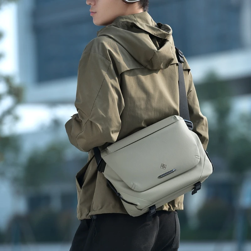 

Travel Sling Bag for Men with Magnetic Buckle, Laptop Compartment, Water Bottle Pocket & Tripod Straps Motorcycle Crossbody Bag