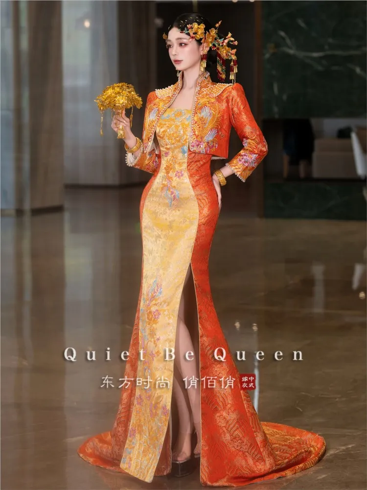 Orange cheongsam with a trailing Chinese wedding dress traditional style and elegant toasting