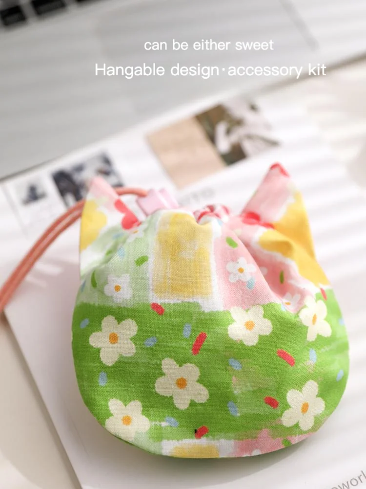 

The small bag with a drawstring opening for storage, a crossbody coin purse, a neck hanger, and a mini card bag hanger