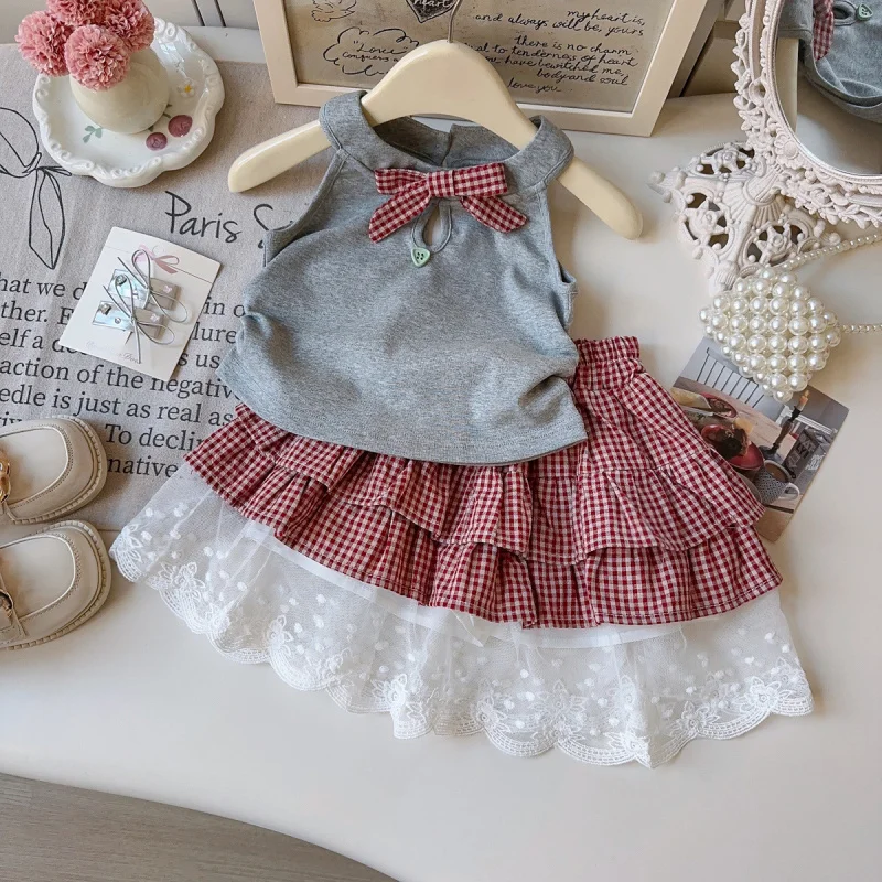 

Girls Suit2026Summer new stylish two-piece set for baby girls: bow-tie halter top and cake skirt