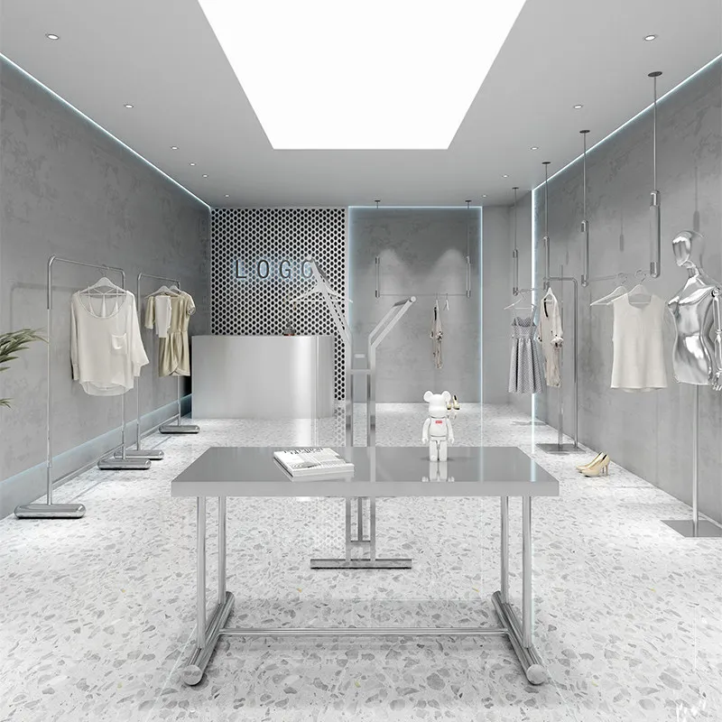 Clothing store display racks: Stainless steel silver hanging clothes racks hang on the wall, displaying shelves for women's